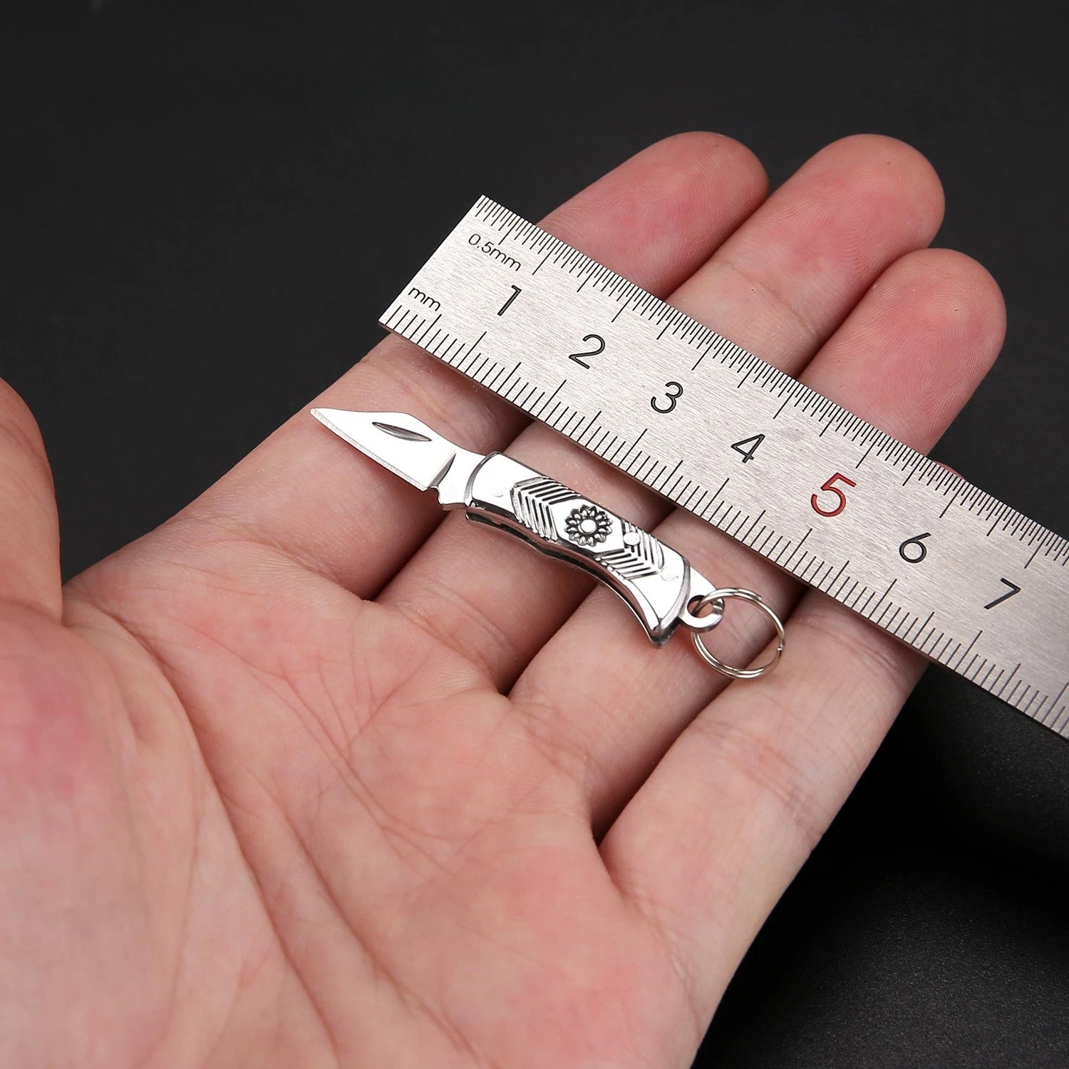 Tiny compact folding pocket knife with stainless steel blade, keychain attachment, lightweight and durable